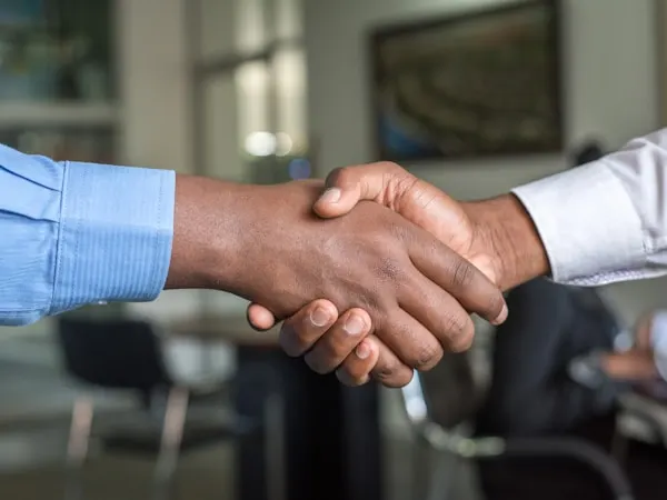 Small Business broker handshake after successful business sale in New Jersey and New York tri-state area