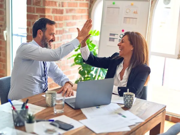 Nexus Bridge small business broker consulting with NJ business owner in a professional meeting